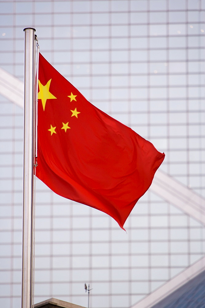 Chinese flag against windows of ultra modern Bank of China, Central District, Hong Kong Island, Hong Kong, China, Asia