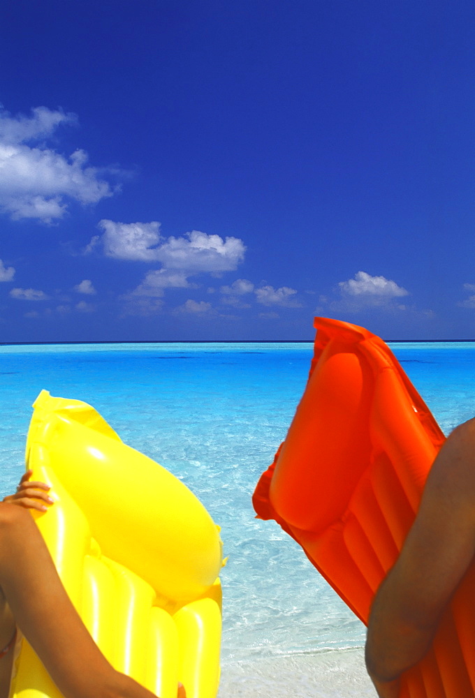 A couple with air matress, Maldives, Indian Ocean, Asia