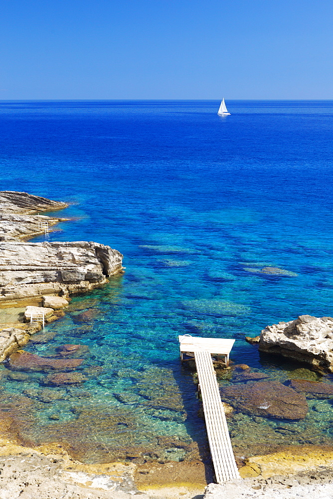 Jetty on the beach and boat, Rhodes, Dodecanese, Greek Islands, Greece, Europe