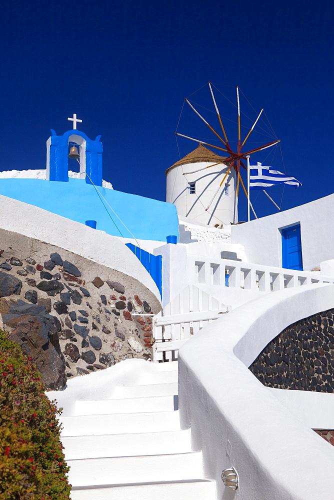 Church, windmill and Greek flag, Santorini, Cyclades, Greek Islands, Greece, Europe