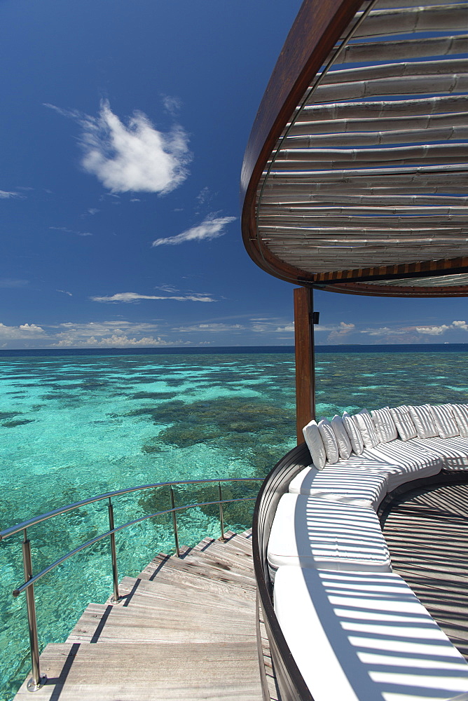 Stairs to the beach and sofa overlooking the ocean, Maldives, Indian Ocean, Asia