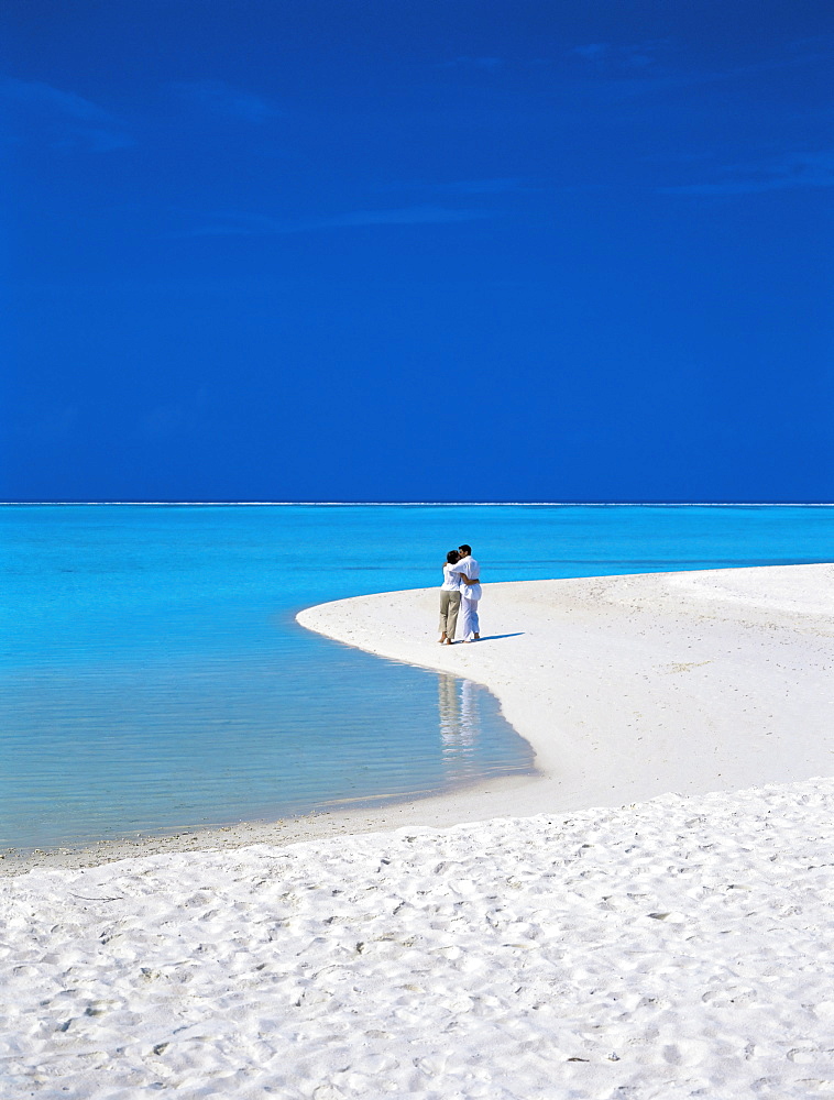 Couple walking on sandy beach, Maldives, Indian Ocean, Asia