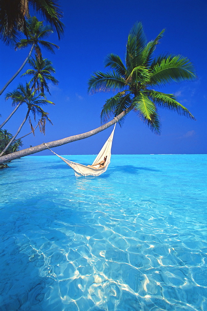 Woman in hammock, Maldives, Indian Ocean, Asia