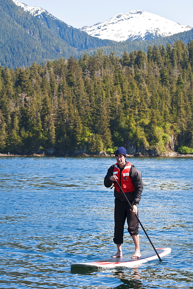 Paddleboarding in Windham Bay in the Chuck River Wilderness Area, Southeast Alaska, United States of America, North America