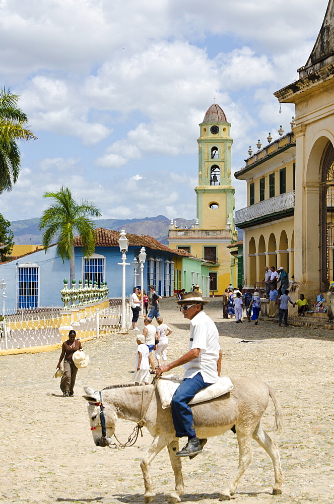 Old man on a donkey, Trinidad, UNESCO World Heritage Site, Cuba, West Indies, Caribbean, Central America