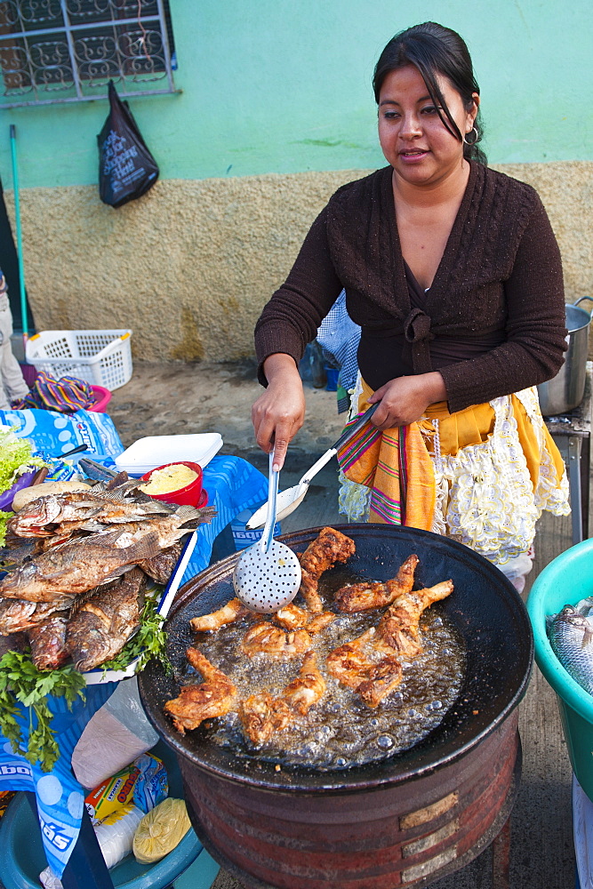 Pollo Campero (fried chicken) in the market at Santiago Sacatepequez, Guatemala, Central America