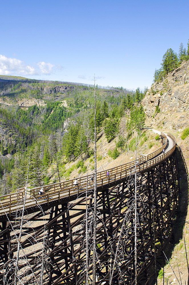 Biking the old railway trestles in the Myra Canyon, Kelowna, British Columbia, Canada, North America 