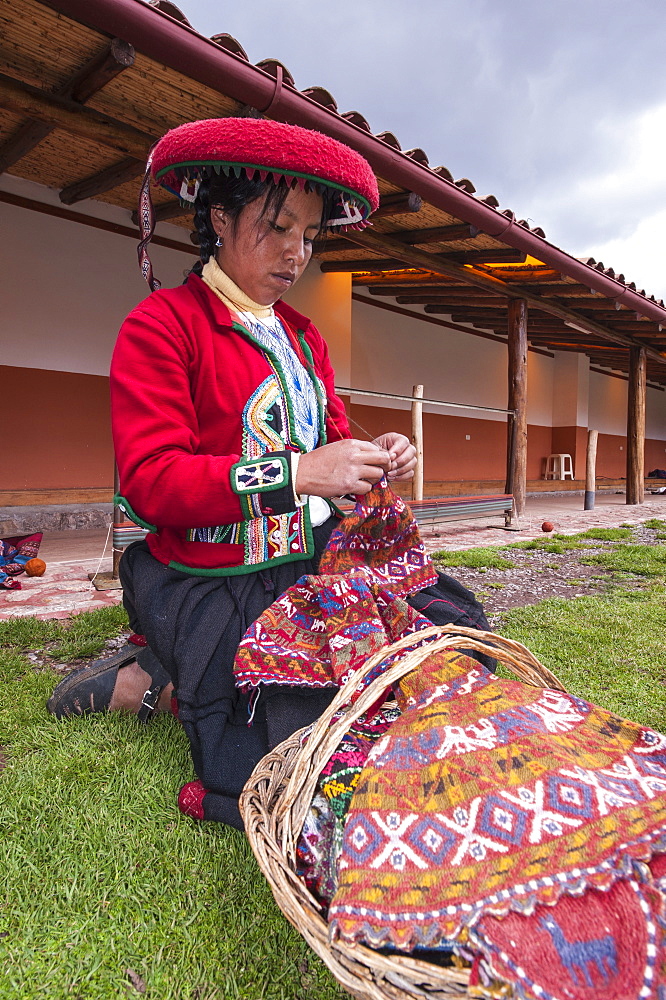 Inca woman knitting wool hat in Chinchero, Peru, South America