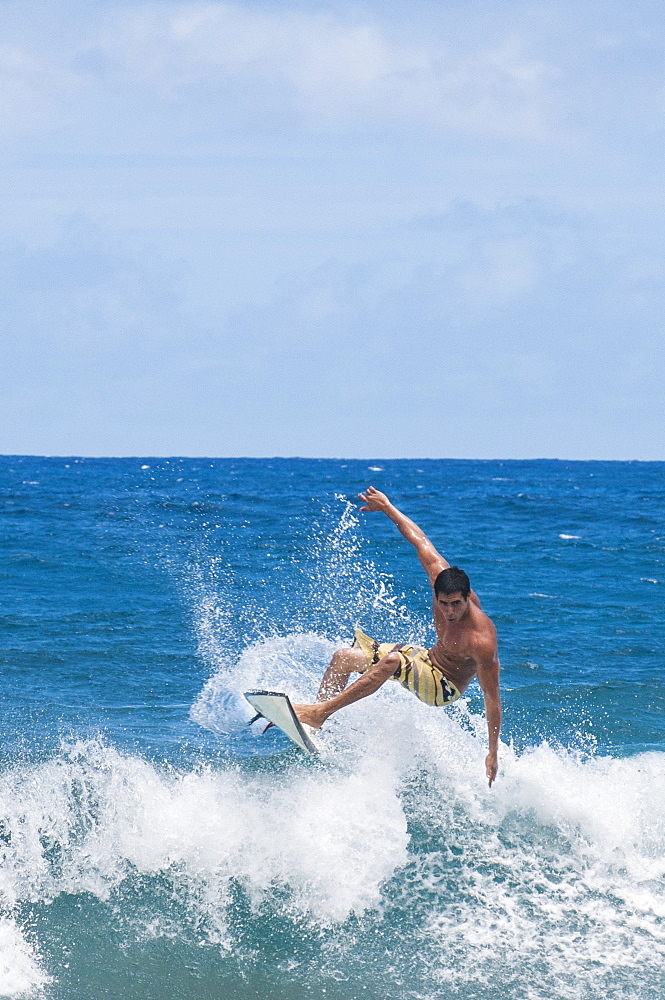 Surfing at Sunset Beach, North Shore, Oahu, Hawaii, United States of America, Pacific