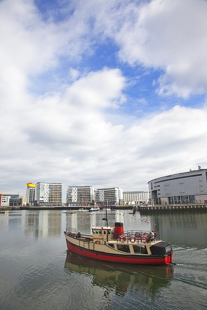 Ireland, North, Belfast, Titanic Quarter, tour boat taking tourists on sightseeing cruise.