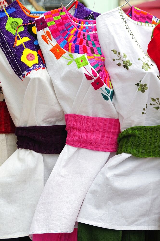 Mexico, Oaxaca, Hand embroidered blouses for sale.