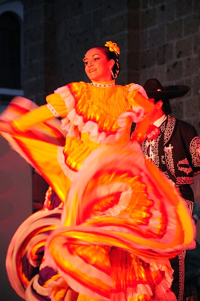 Mexico, Jalisco, Guadalajara, Plaza Tapatia Folk dancer from Jalisco State dancing at carnival.