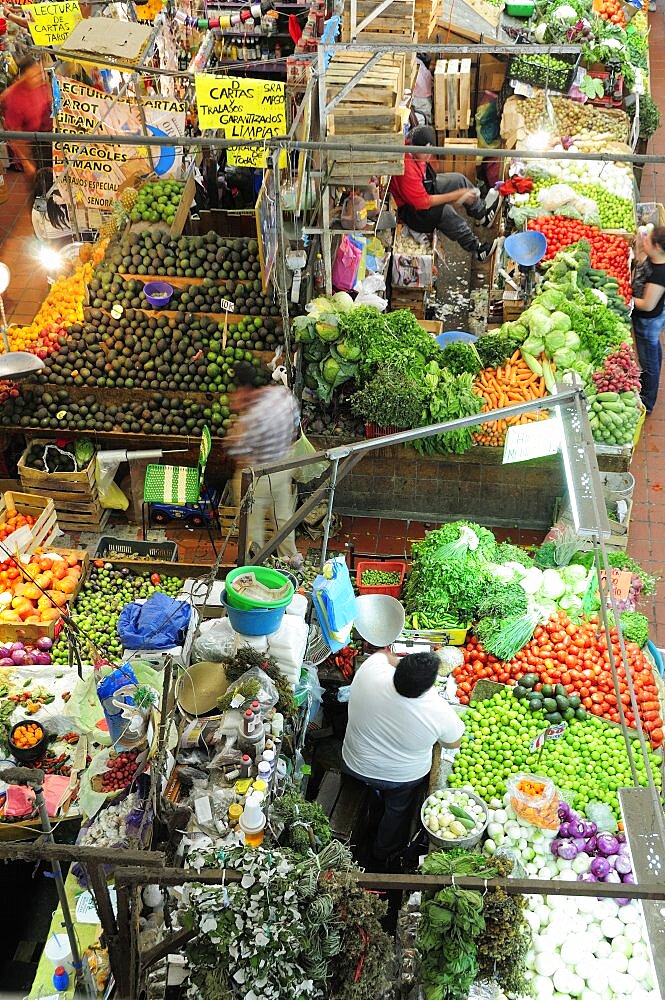 Mexico, Jalisco, Guadalajara, Mercado Libertad View down on vegetable market stall displays and vendors.