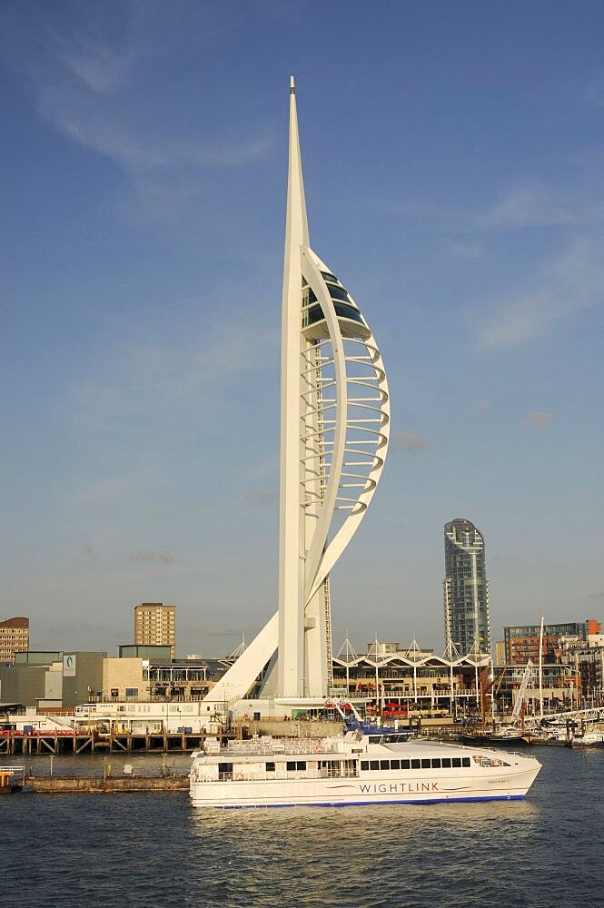 England, Hampshire, Portsmouth, Spinnaker Tower and Gunwharf Quay shopping center seen from the harbour.