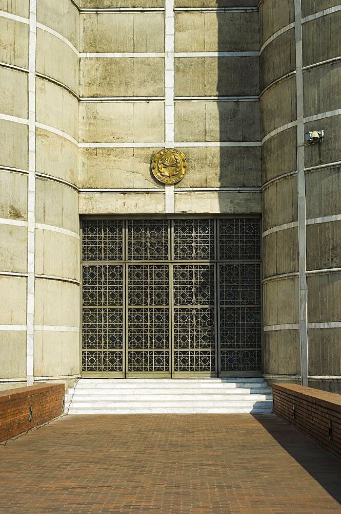 Bangladesh, Dhaka, National Assembly building designed by Louis Kahn using innovative concrete and geometric design.