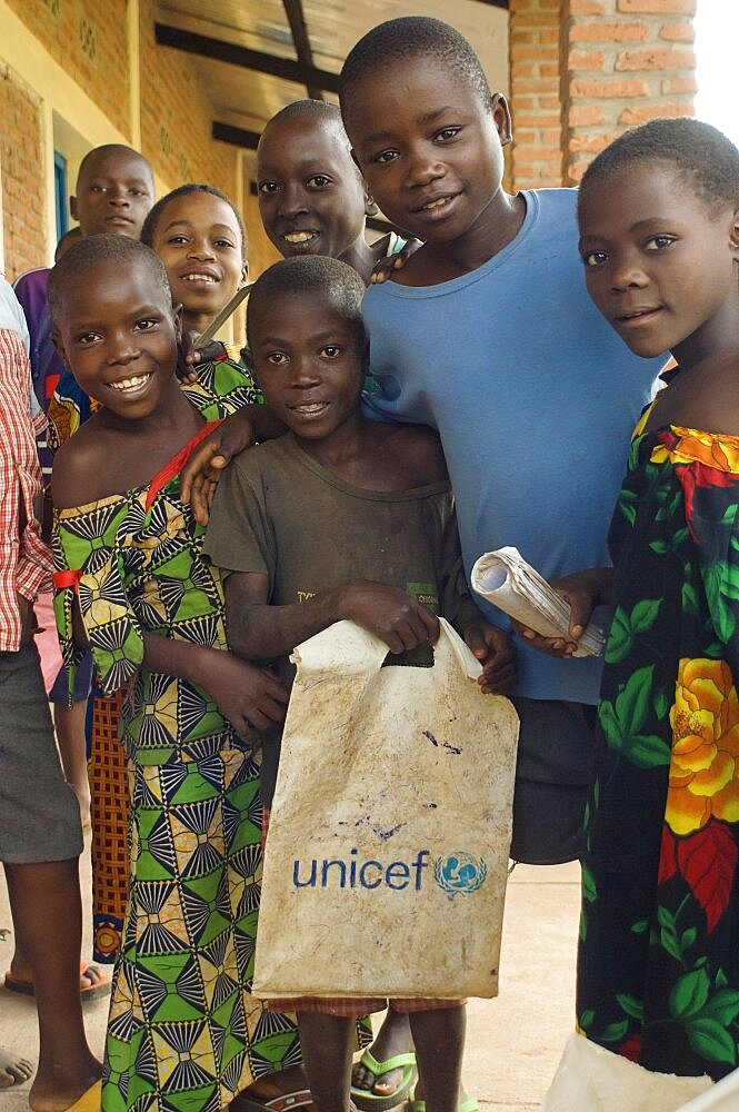 Burundi, Cibitoke Province, Buganda, School Children at a development project one holding a UNICEF carrier bag at Ruhembe Primary School.