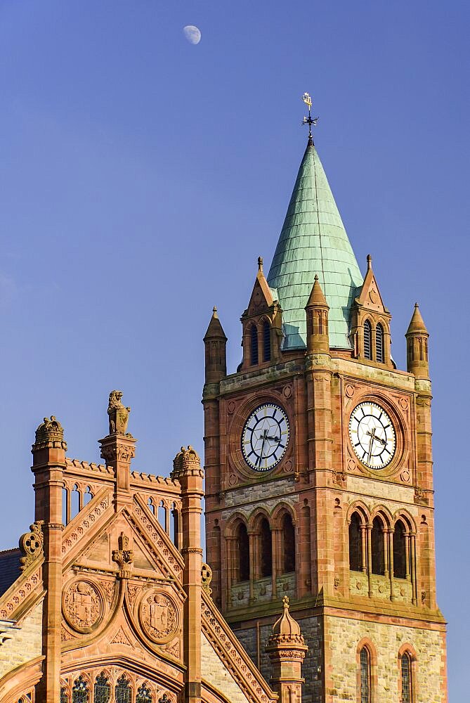 Ireland, North, Derry, The Guildhall, The Clock Tower with moon in the sky above.