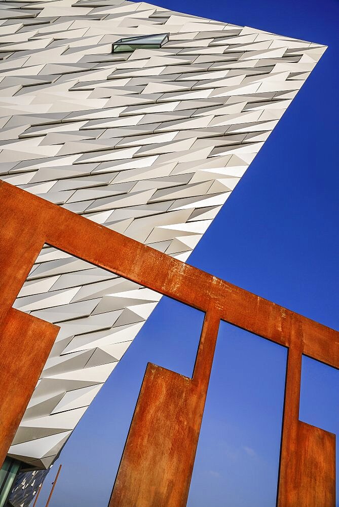 Ireland, North, Belfast, Titanic Quarter, Titanic Belfast Visitor Experience, Graphic shapes of a section of the building and the Titanic sign.