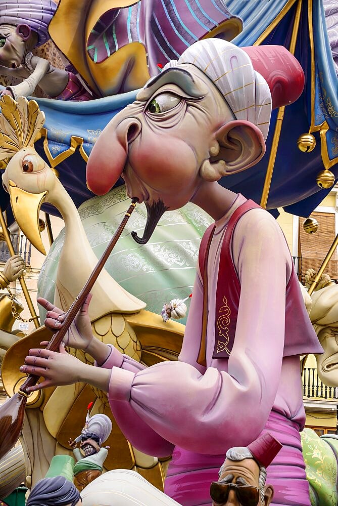 Spain, Valencia Province, Valencia, Papier Mache figure in the street during Las Fallas festival.