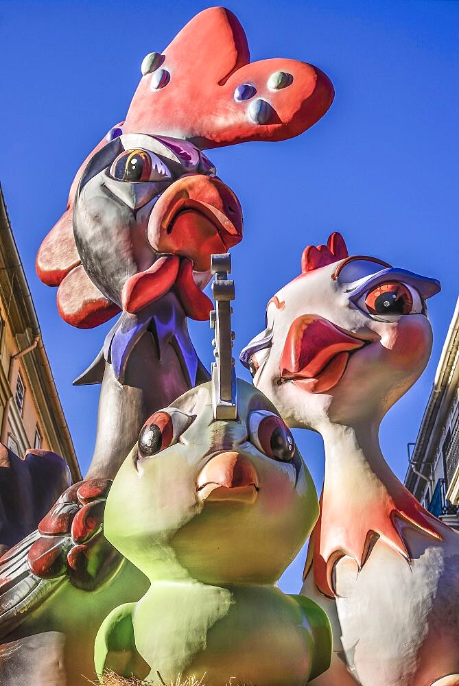 Spain, Valencia Province, Valencia, Papier Mache figures in the street during Las Fallas festival.