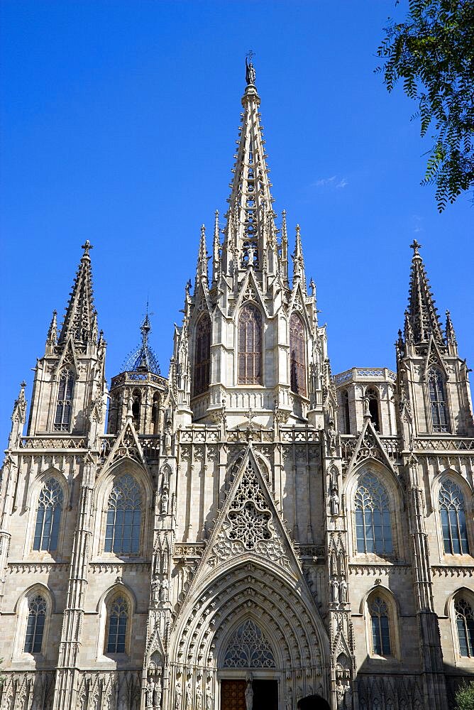 Spain, Catalonia, Barcelona, The spire and main facade of the Cathedral in the Old Town district., 1,