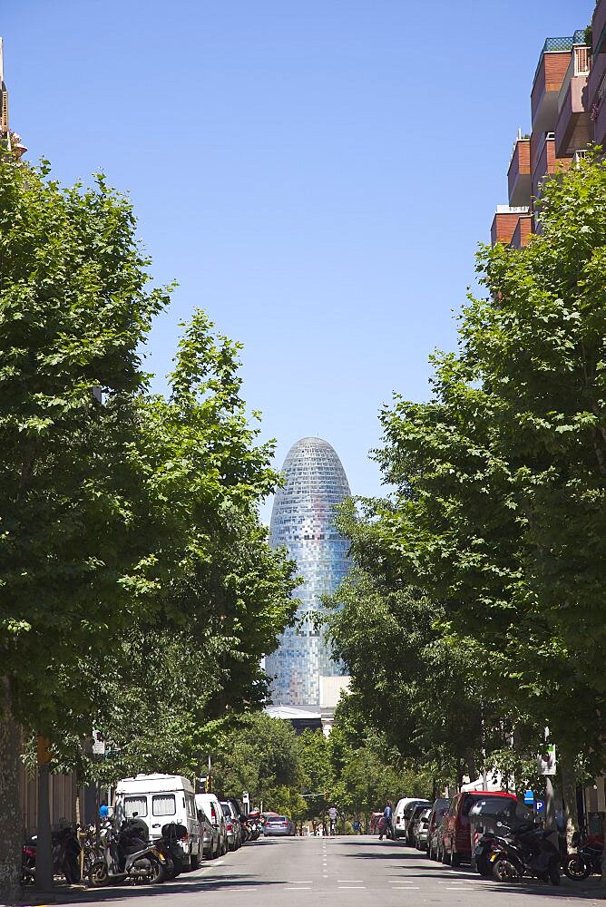 Spain, Catalonia, Barcelona, Torre Agbar modern glass fronted tower in the Eixample district.