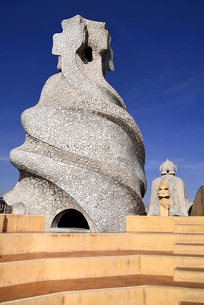 Spain, Catalunya, Barcelona, Antoni Gaudi's La Pedrera building, a section of chimney pots on the roof terrace.