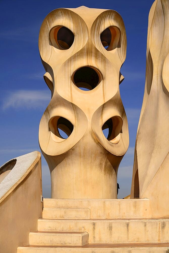 Spain, Catalunya, Barcelona, Antoni Gaudi's La Pedrera building, a section of chimney pots on the roof terrace.