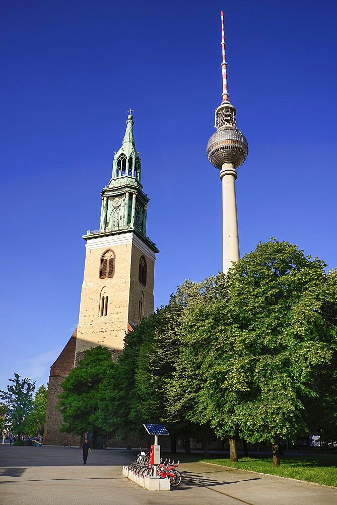 Germany, Berlin, Fernsehturm, Berlin's TV Tower overlooking Marienkirche also known as St Marys Church.