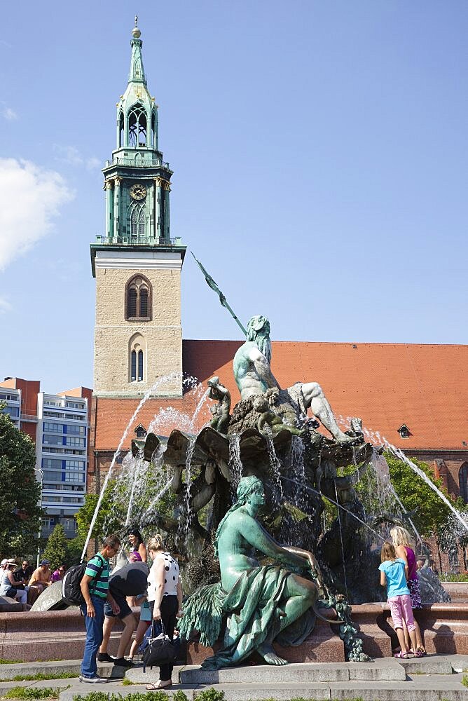 Germany, Berlin, Mitte, Neptunbrunnen fountain next to St Marienkirche in Alexanderplatz.