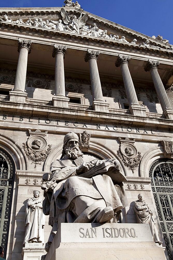 Spain, Madrid, Statue of San Isidoro on the steps of the National Library.