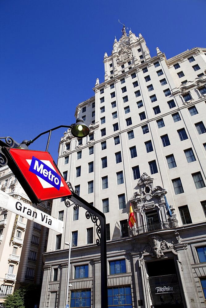 Spain, Madrid, Metro Sign outside Edificio Telefonica on Gran Via.