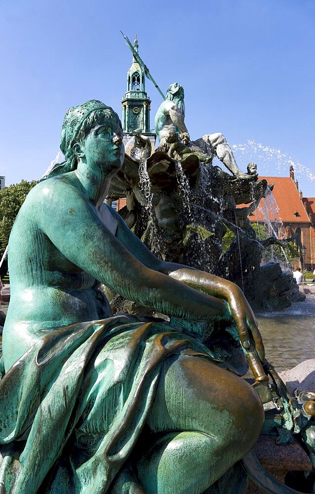 Germany, Berlin, Mitte, The Neptune Fountain or Neptunbrunner by Reinhold Begas dated 1891 with a female statue representing the Elbe one of the four main rivers of Prussia beside Marienkirche St Mary's Church.