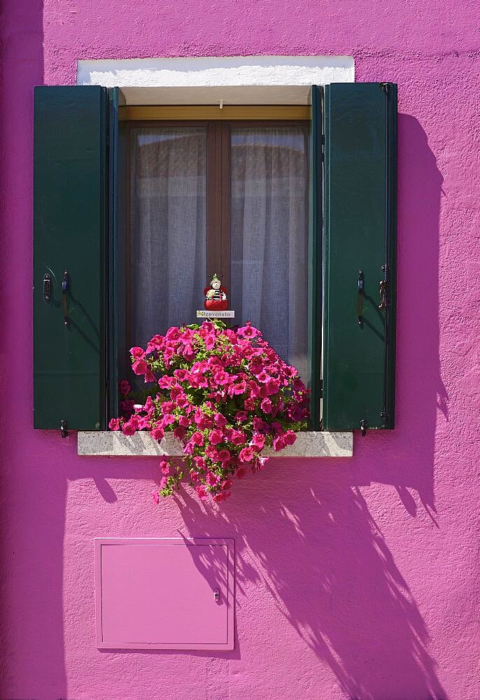 Italy, Veneto, Burano Island, Colourful row of house facades.