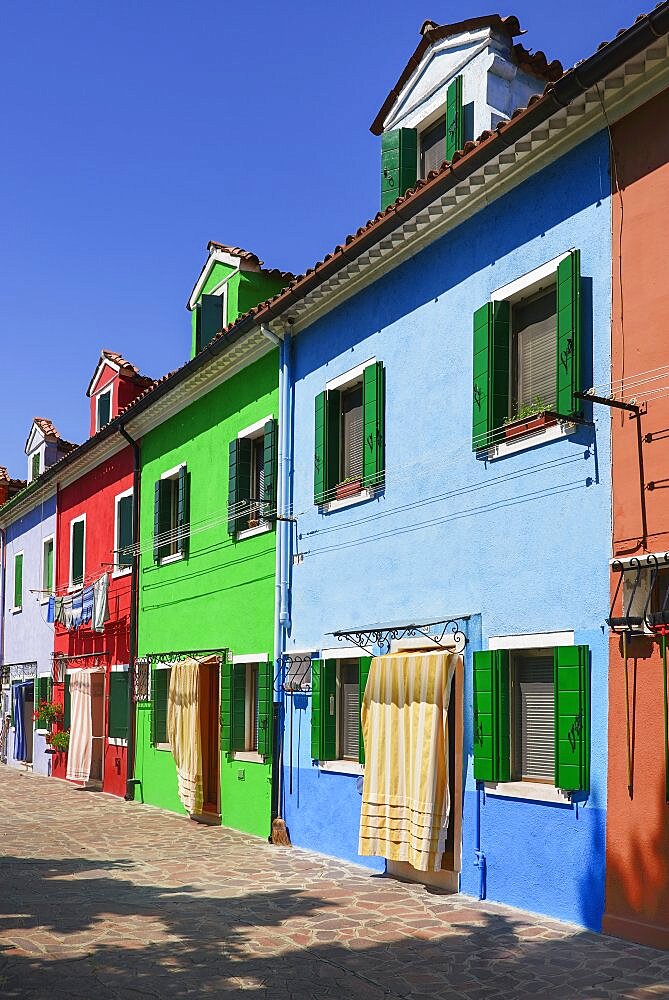 Italy, Veneto, Burano Island, Colourful row of house facades.