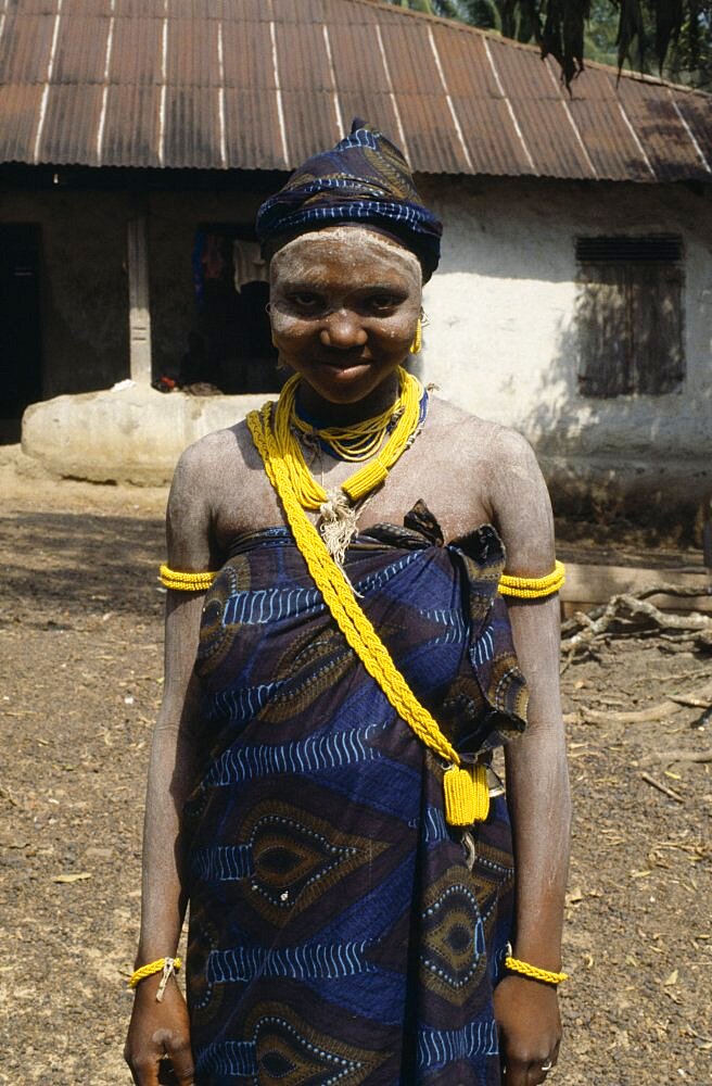 SIERRA LEONE  People Full length portrait of a smiling Mende girl a society initiate.