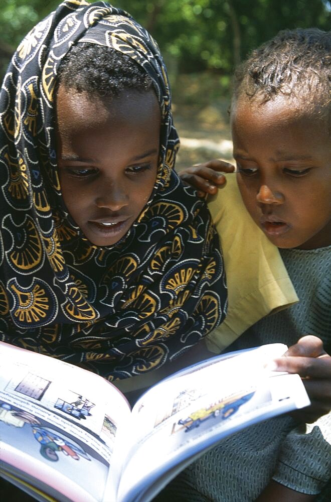 SOMALIA  Habare Village Children using new Somali textbooks produced by Unicef.