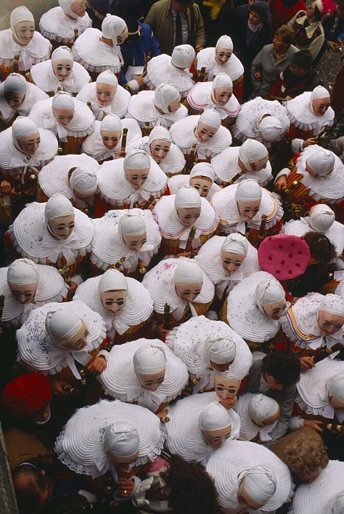 BELGIUM Walloon Region Binche Les Gilles parade in medieval costume at carnival.