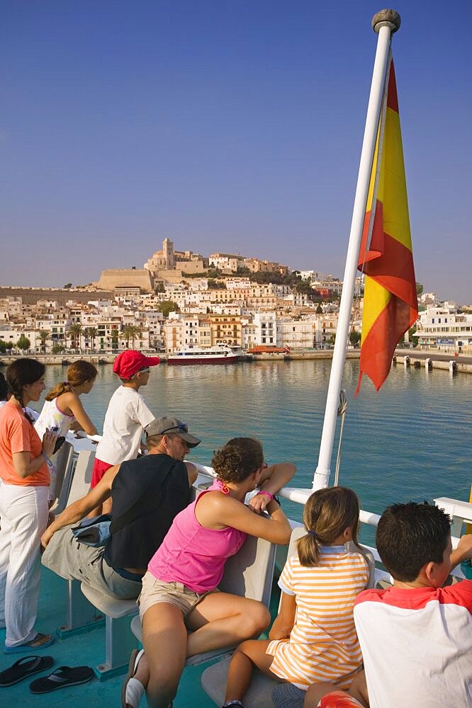 SPAIN Balearic Islands Ibiza Passengers on board a ferry leaving Eivissa for Formentera  Spanish flag. Holidays Tourism Travel