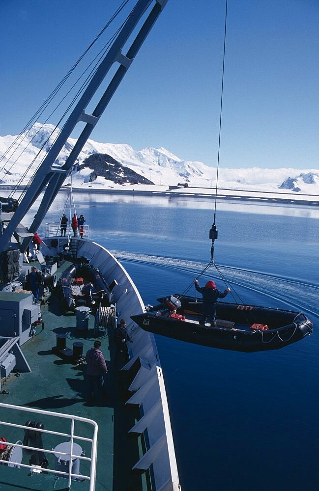 ANTARCTICA  Transport Lowering Zodiac inflatable boats from a ship for taking passengers ashore