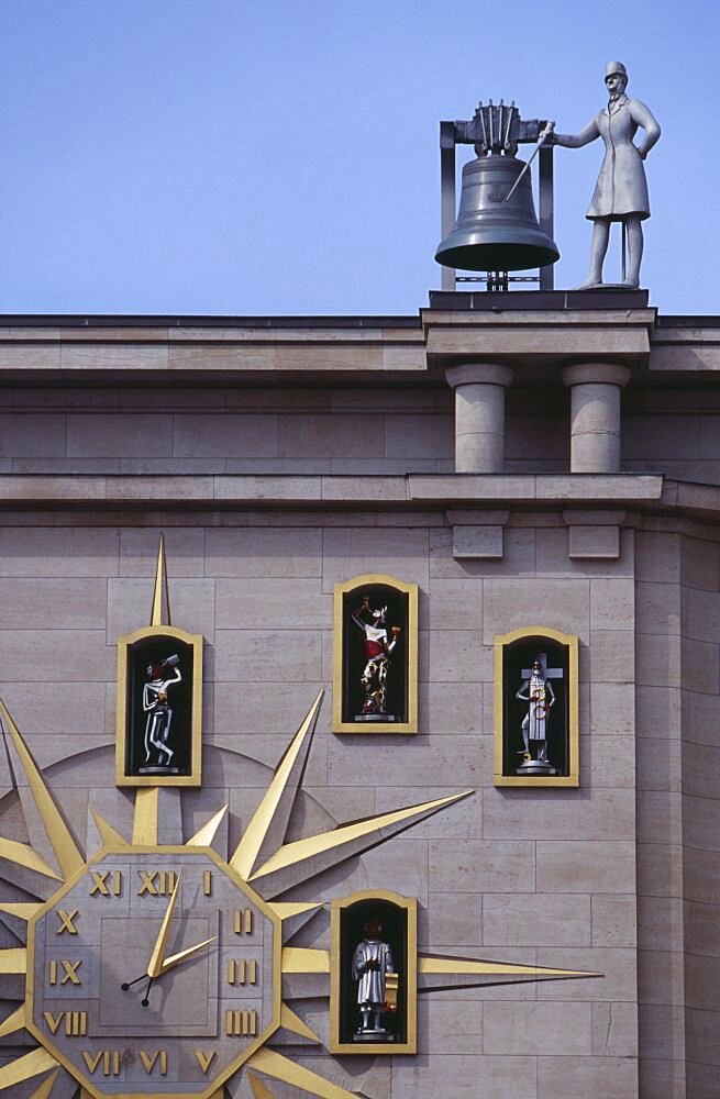 BELGIUM Brabant Brussels Detail of building facade and Jacquemart clock.  Figures representing citizens of Brussels surround the clock face and move to announce the change of hour.
