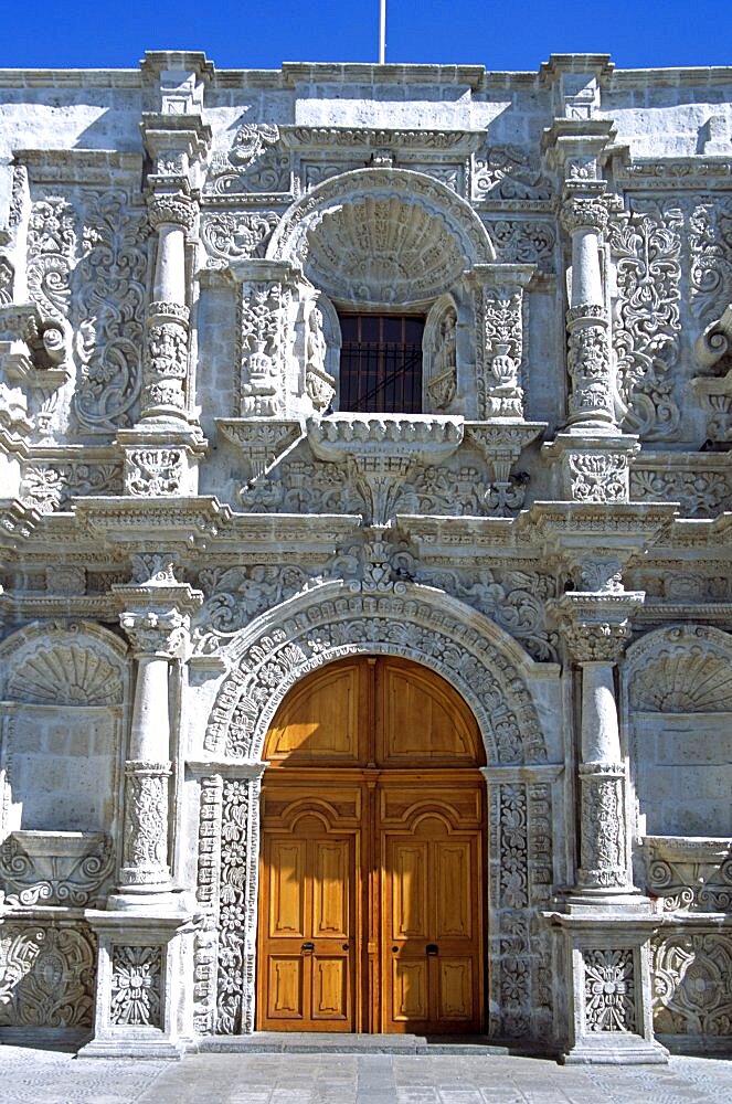 PERU  Arequipa Iglesia de San Agustin. Travel Tourism Holiday Vacation Explore Recreation Leisure Sightseeing Tourist Attraction Tour Destination Iglesia De San Saint St Agustin Arequipa Peru Peruvian South Southern America Latin Tranquility Tranquil City Traditional Sunny Culture Cultural Peaceful Building Architecture Architectural Church Churches Religion Religious Pray Prayer Worship Worshipping Worshiping Christianity Holy Divine Christian Theology Faith Sacred Devout Catholic Catholicism Ethnic Spanish Hispanic Colonial UNESCO World Heritage Site Vivid Vibrant Faade Edifice Ornate Intricate Colourful Grey Gray Entrance Door Detailed Columns Pillars Magnificent Impressive Majestic Symmetry Symmetrical Beautiful Converge Converging Convergent Calendar American Colorful South America