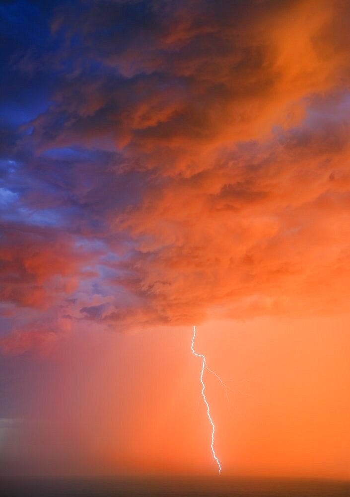 Bolt of lightening at sunset, Wild Coast, Eastern Cape, South Africa