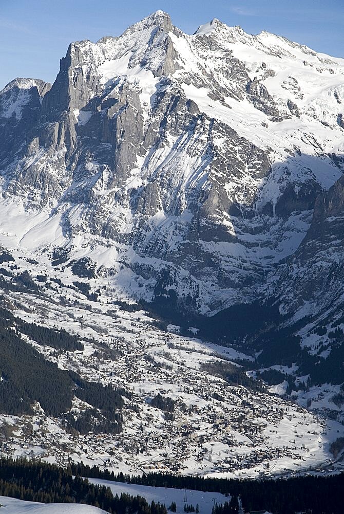 The town of Grindelwald spread out under Wetterhorn Mountain, Grindelwald, Bernese Oberland, Switzerland