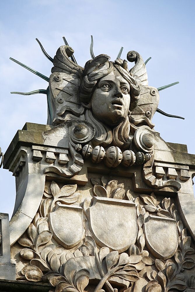 Poland, Krakow, Head of Apollo on top of the entrance to the Palace of Arts built in 1901 for the Society of Fine Arts Friends