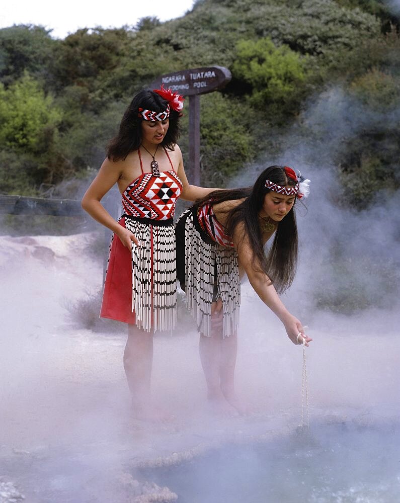 New Zealand, North Island, Rotorua Thermal Pools with Maori girls in traditional dress