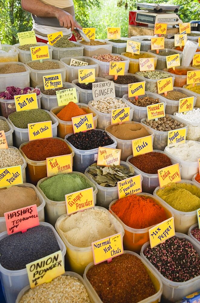 Turkey, Aydin Province, Kusadasi, Satll at weekly market selling spices and chili powders in brightly coloured display