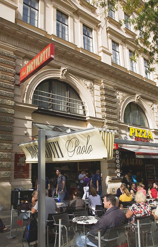 Austria, Vienna, Cafe exterior with customers seated at outside tables