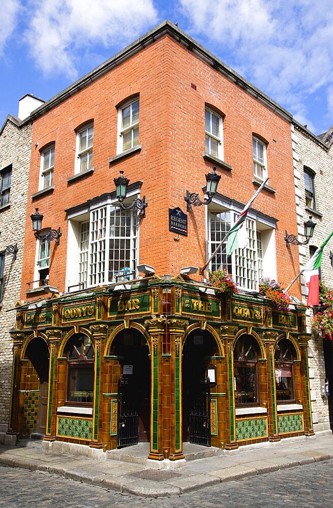 Ireland, County Dublin, Dublin City, The Quays public house on a street corner in Temple Bar with a cobbled road.