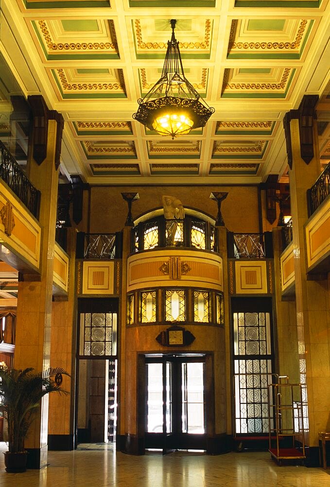 Peace Hotel Interior of foyer with marble floor upper balcony and revolving door at entrance, Shanghai, China